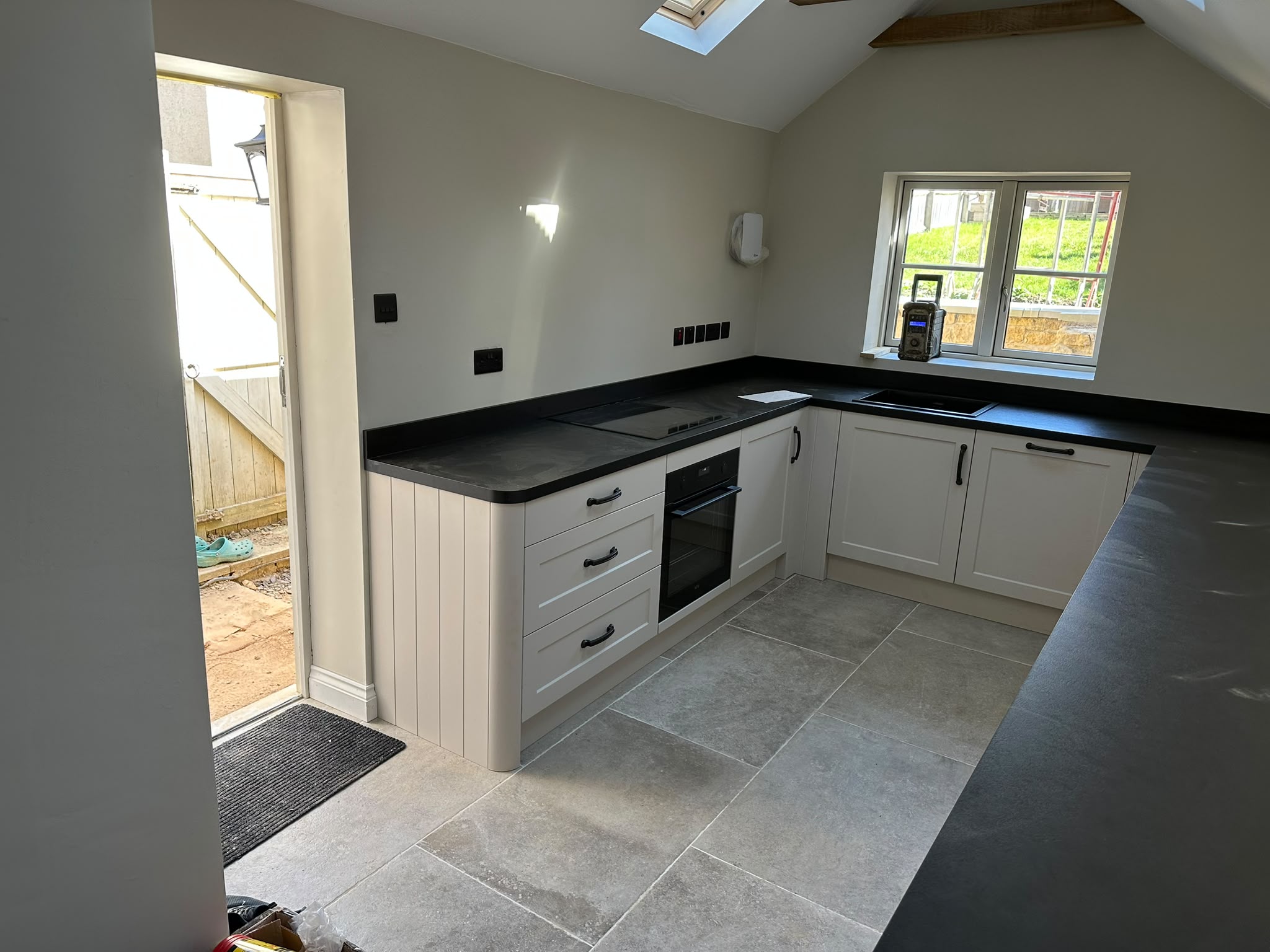 Shaker kitchen with dark worktops